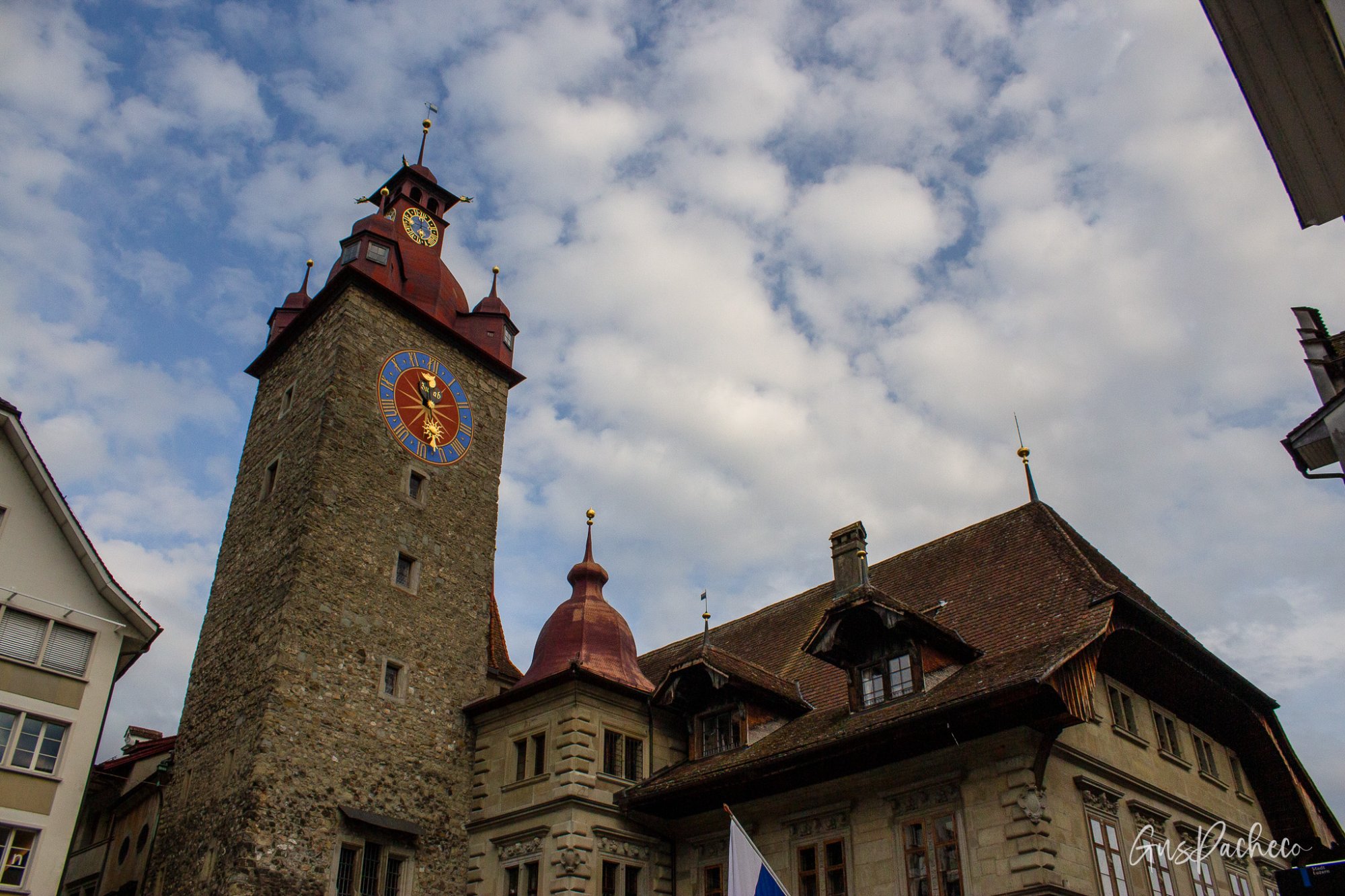 The Rathaus clock tower rising above Kornmarkt, Lucerne