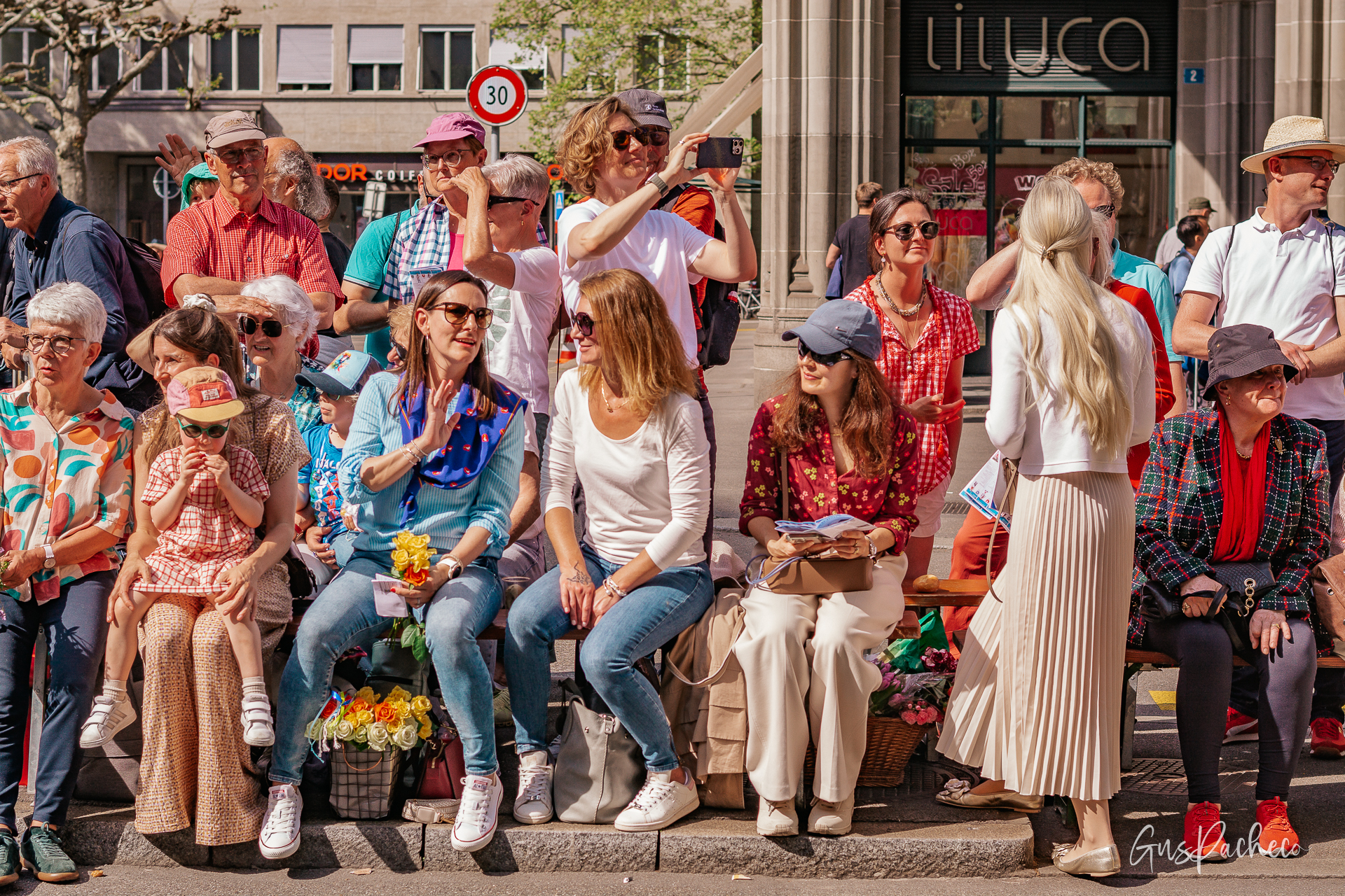 Sechseläuten Zürich aerial — parade along Limmatquai with Hotel Krone and Fraumünster