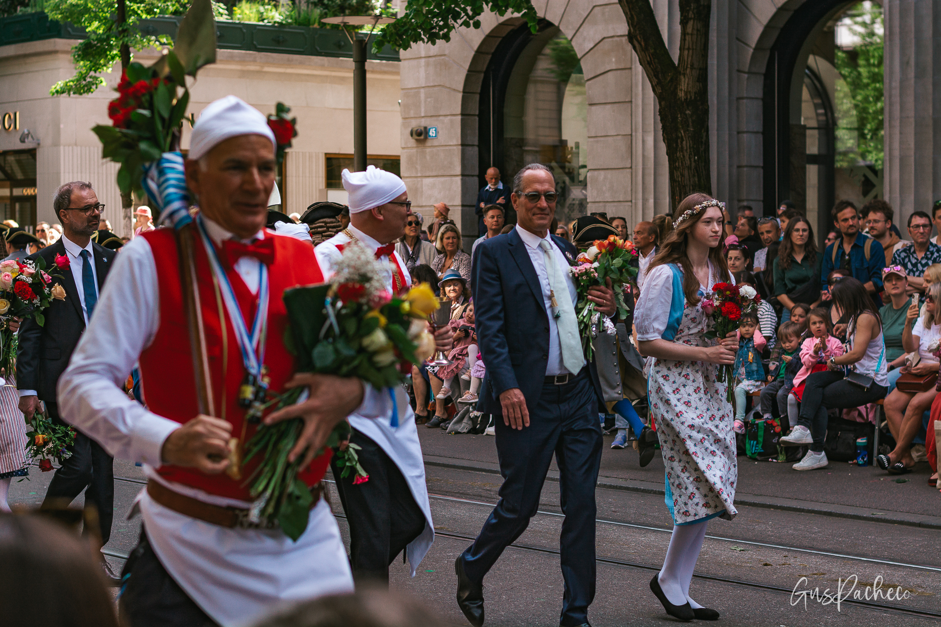 Sechseläuten — young woman in red holding roses among the crowd