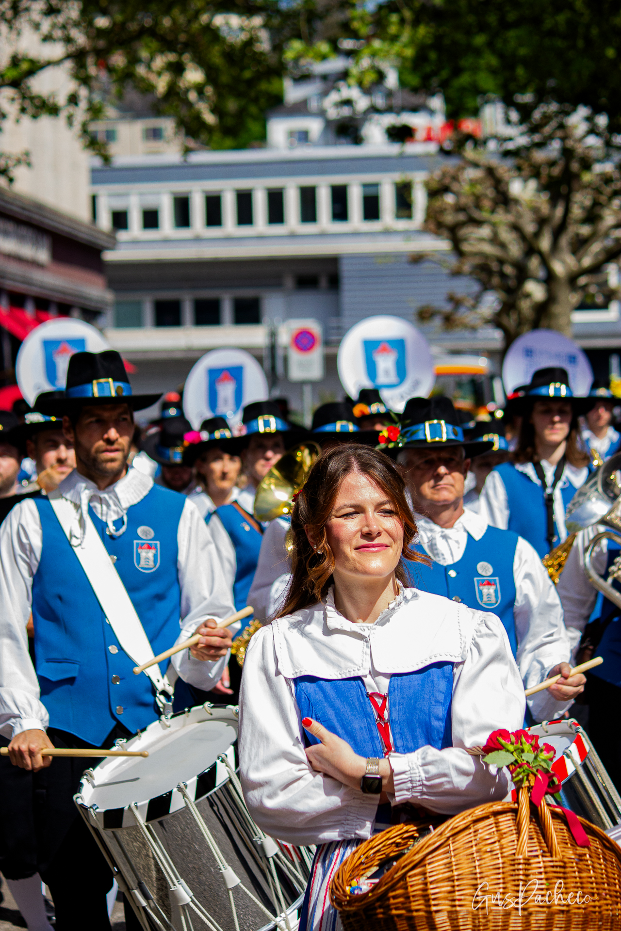 Sechseläuten guild parade — woman leading drum corps in traditional blue costume